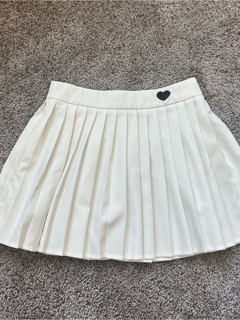 SHEIN Cream Pleated Mini Skirt with Black Heart